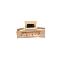 Load image into Gallery viewer, A beige claw hair clip with a cream-colored chip on the top, placed on a white background.
