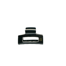 Load image into Gallery viewer, A black claw clip hair accessory made of acetate, displayed against a white background.

