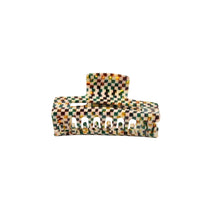 Load image into Gallery viewer, A multicolored geometric-patterned claw hair clip on a white background.
