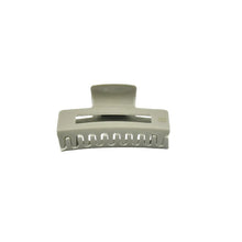 Load image into Gallery viewer, A sage green colored claw clip hair accessory on a white background.
