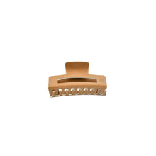 Load image into Gallery viewer, A tan and white claw hair clip with a strong grip mechanism, displayed on a white background.
