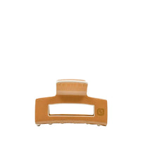 Load image into Gallery viewer, A tan colored claw clip hair accessory on a white background
