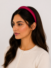 Load image into Gallery viewer, Woman wearing a red satin headband against a plain background
