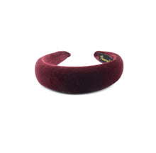Load image into Gallery viewer, A burgundy velvet padded headband on a plain background.

